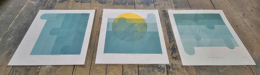 Blue Transparency I, II, III vinyl wall art by Claire Davis of InkBird Print Studio with geometric blue, green, and yellow abstract screen prints.