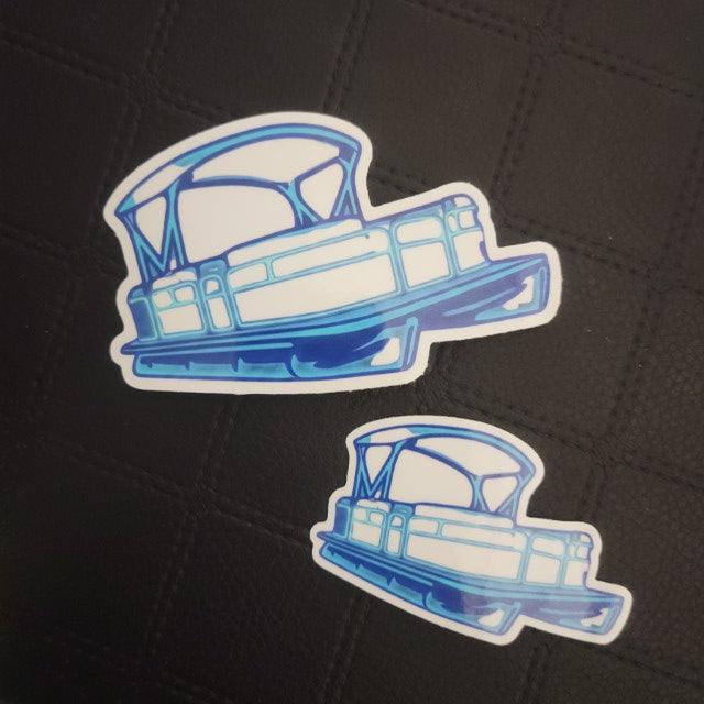Blue and white pontoon boat vinyl die cut stickers by InkBird Print Studio, large and small sizes, on black grid background. Printed for Good Days Marina