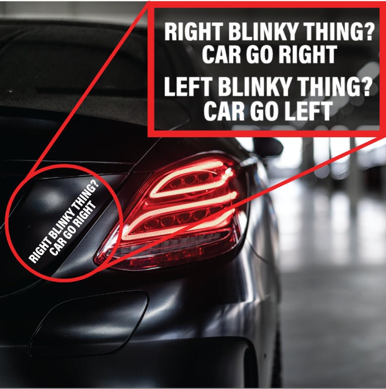 Close-up of a vinyl turn signal decal in white text, reading “RIGHT BLINKY THING? CAR GO RIGHT. LEFT BLINKY THING? CAR GO LEFT.”.