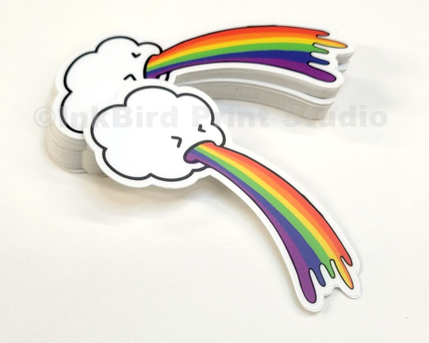 Vinyl Rainbow Cloud Sticker by InkBird Print Studio—white cloud cartoon face, vivid rainbow vomit, weatherproof, 3-inch adhesive decal.